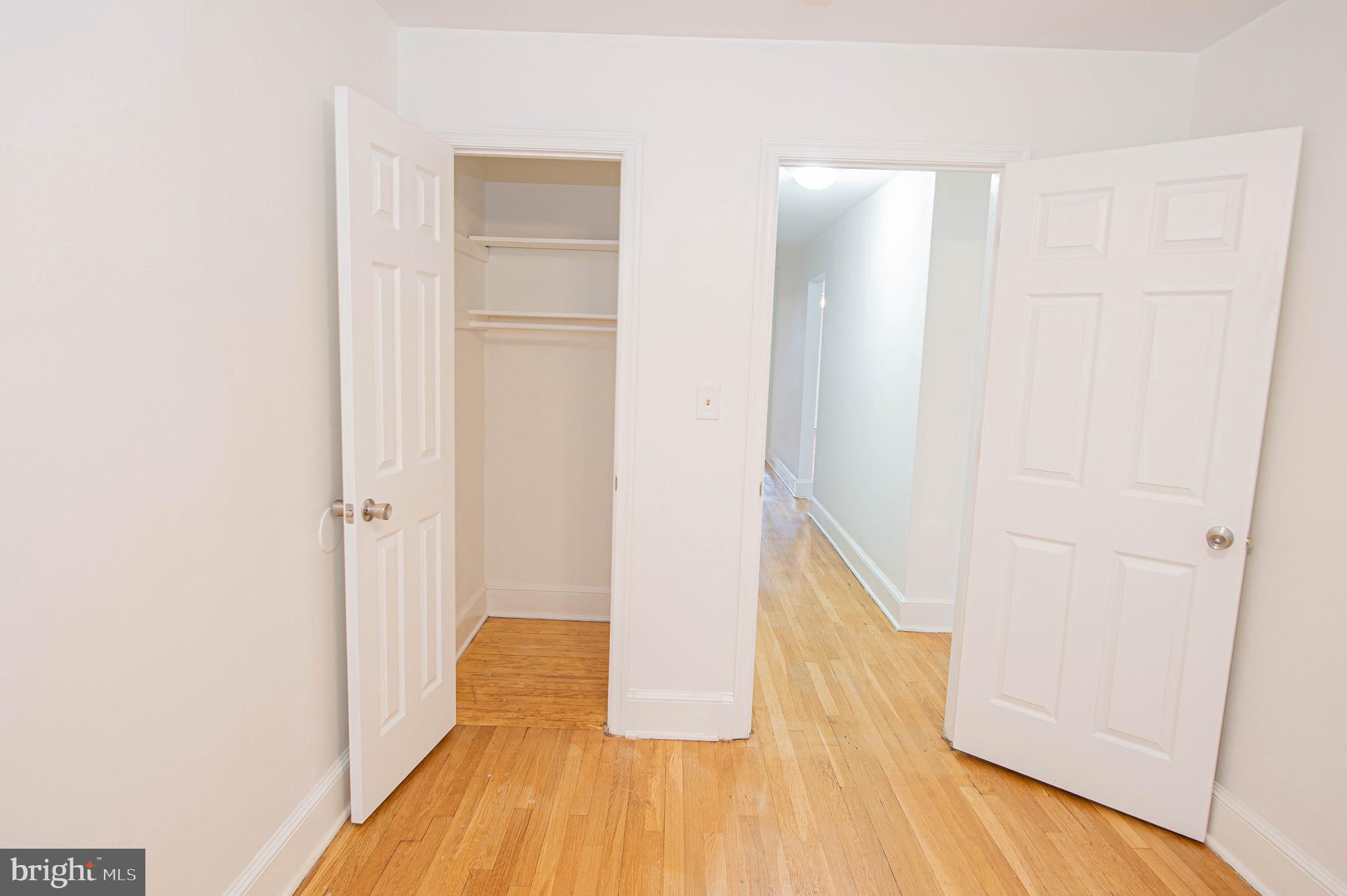 308 North Division Street, Unit 16 Salisbury, MD 21801 - Photo 39 of 61 a view of walk in closet with rug