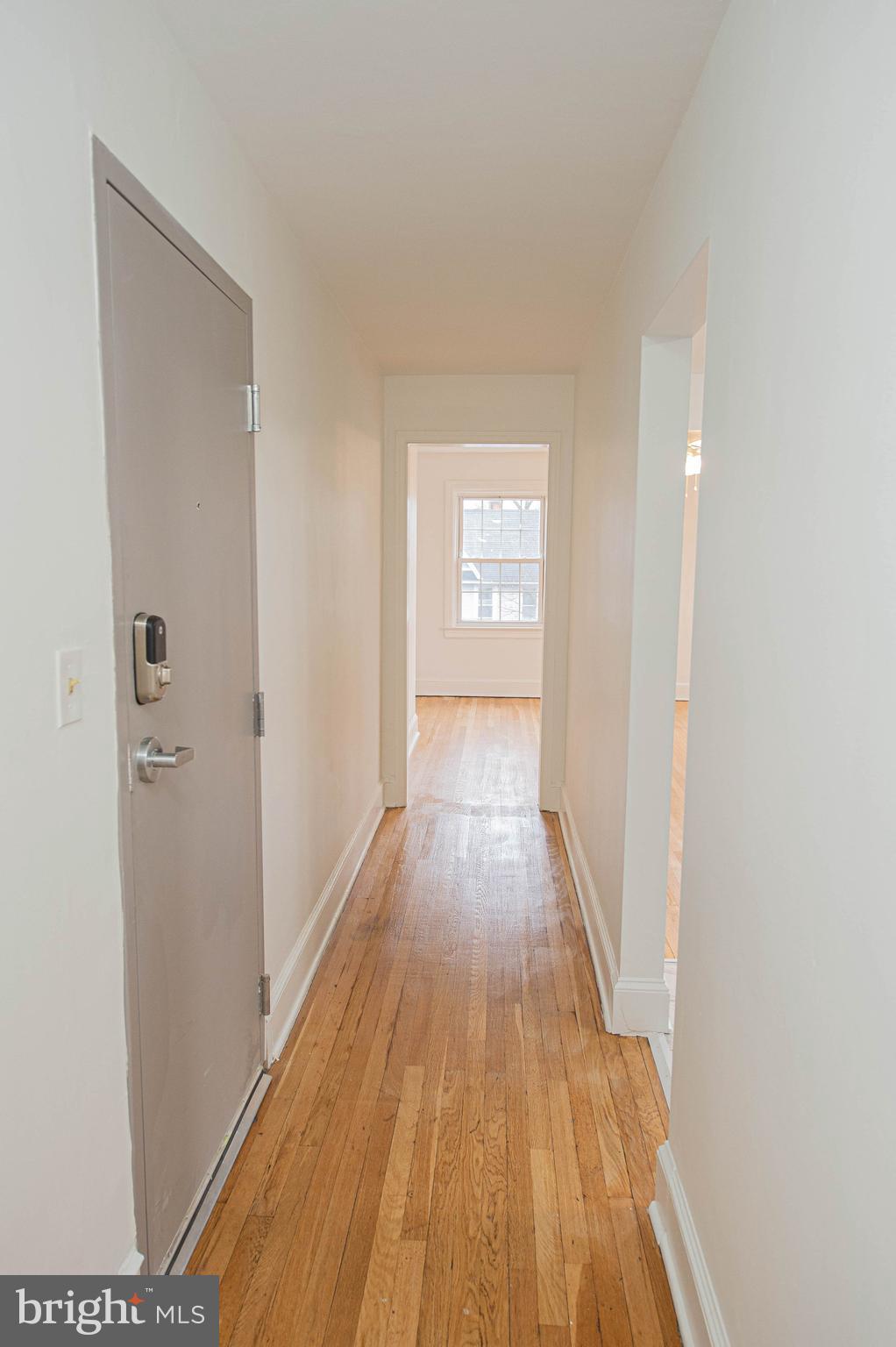 308 North Division Street, Unit 16 Salisbury, MD 21801 - Photo 9 of 61 a view of a hallway with wooden floor