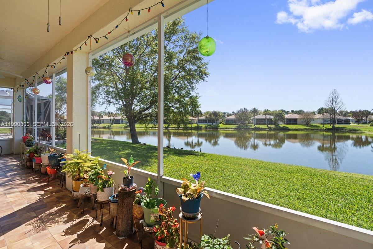 337 Southwest Maclay Way Port St. Lucie, FL 34986 - Photo 2 of 44 a view of a lake with a patio