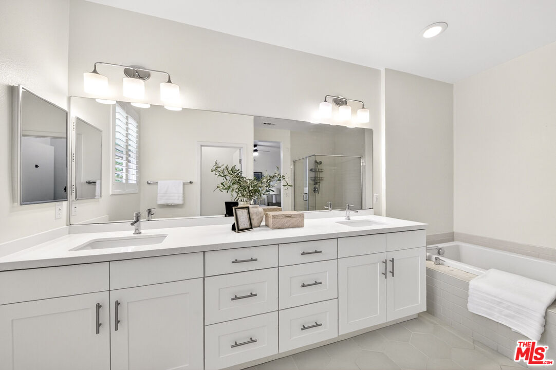 676 Colorado Circle Carson, CA 90745 - Photo 23 of 36 a bathroom with a granite countertop sink double and mirror