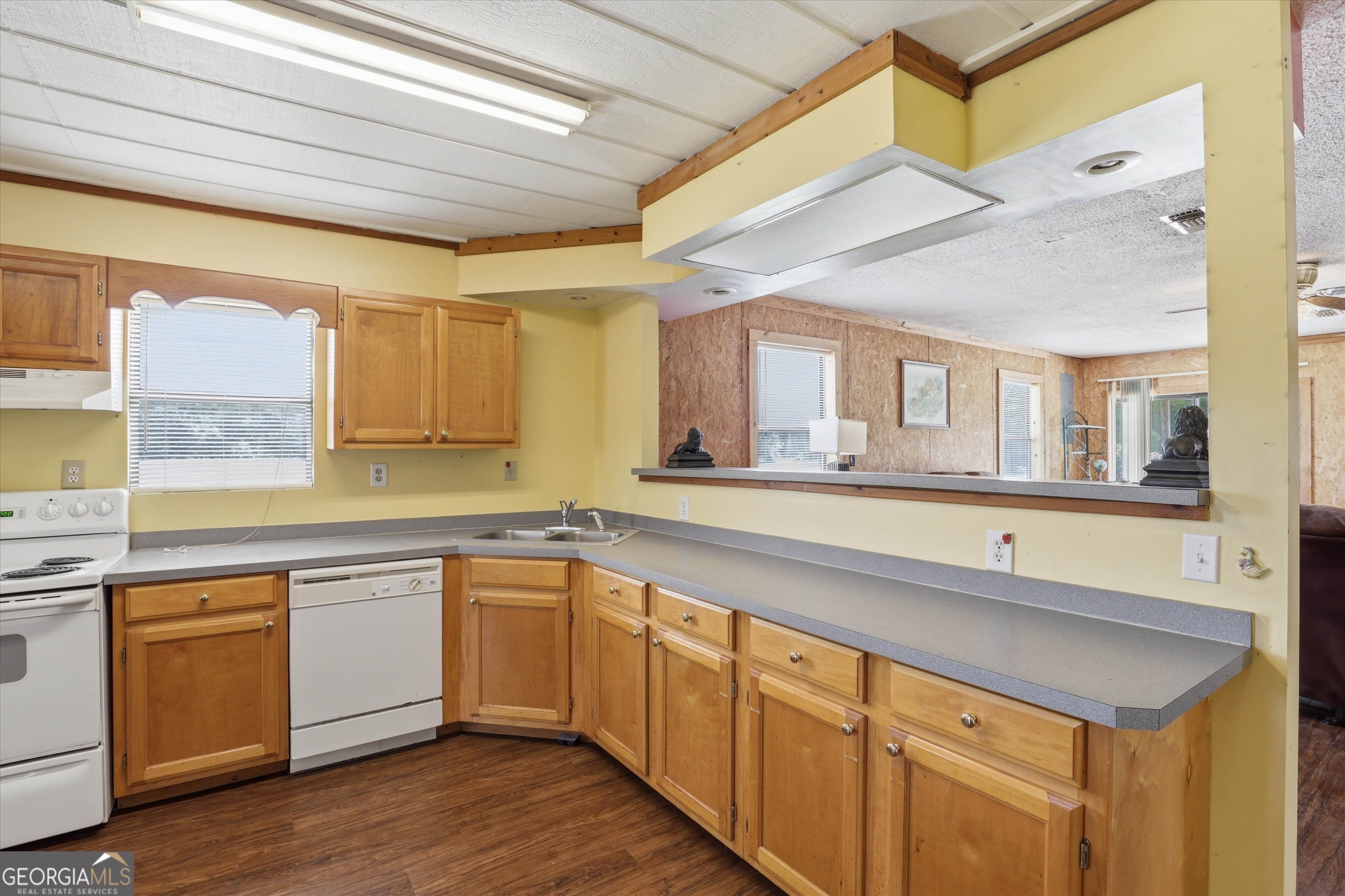 1525 Myron Hart Road Coolidge, GA 31738 - Photo 12 of 58 a large kitchen with a sink and cabinets