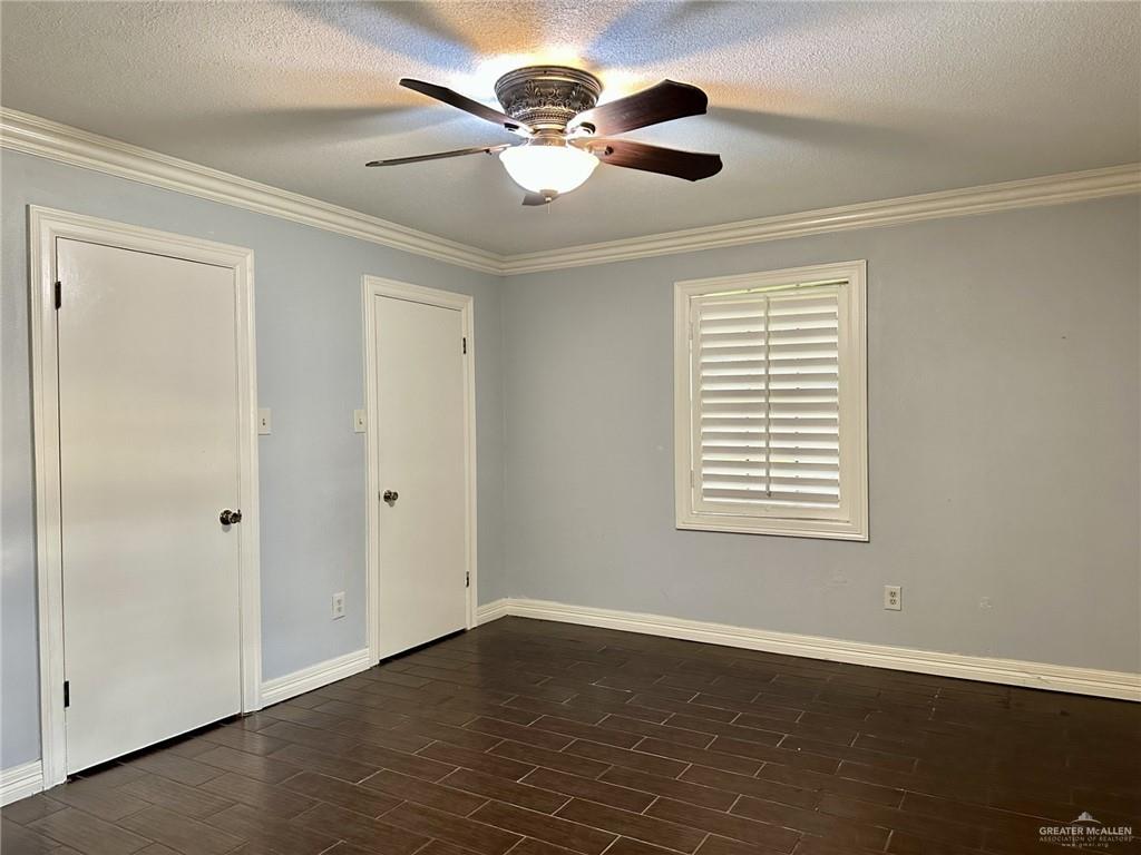 1518 Redbud Avenue McAllen, TX 78504 - Photo 19 of 39 wooden floor in an empty room with a window