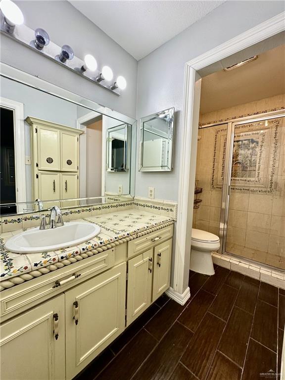 1518 Redbud Avenue McAllen, TX 78504 - Photo 21 of 39 a bathroom with a granite countertop sink toilet and shower