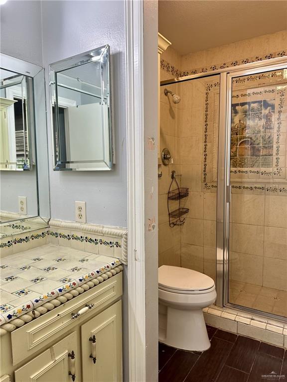1518 Redbud Avenue McAllen, TX 78504 - Photo 22 of 39 a bathroom with a granite countertop sink toilet and shower