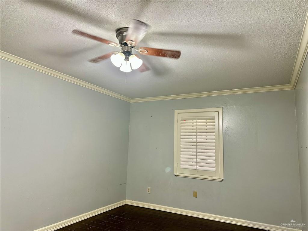 1518 Redbud Avenue McAllen, TX 78504 - Photo 24 of 39 an empty room with a window and a fan