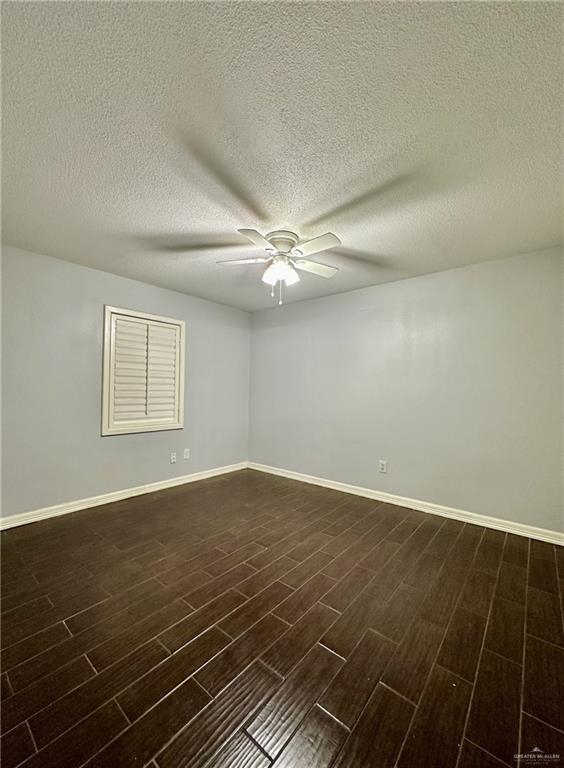 1518 Redbud Avenue McAllen, TX 78504 - Photo 26 of 39 an empty room with wooden floor and fan