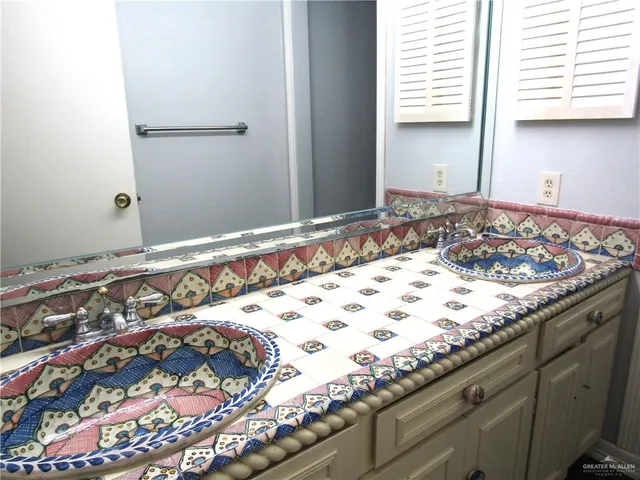 a front view of a house with outdoor seating