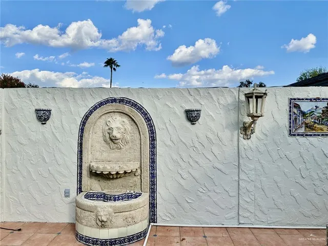 a bedroom with a bed and a fireplace