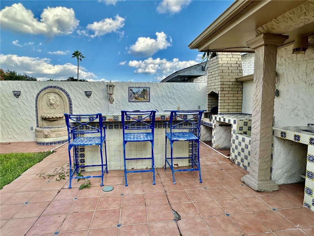 1518 Redbud Avenue McAllen, TX 78504 - Photo 33 of 39 a view of a chairs and tables in the patio