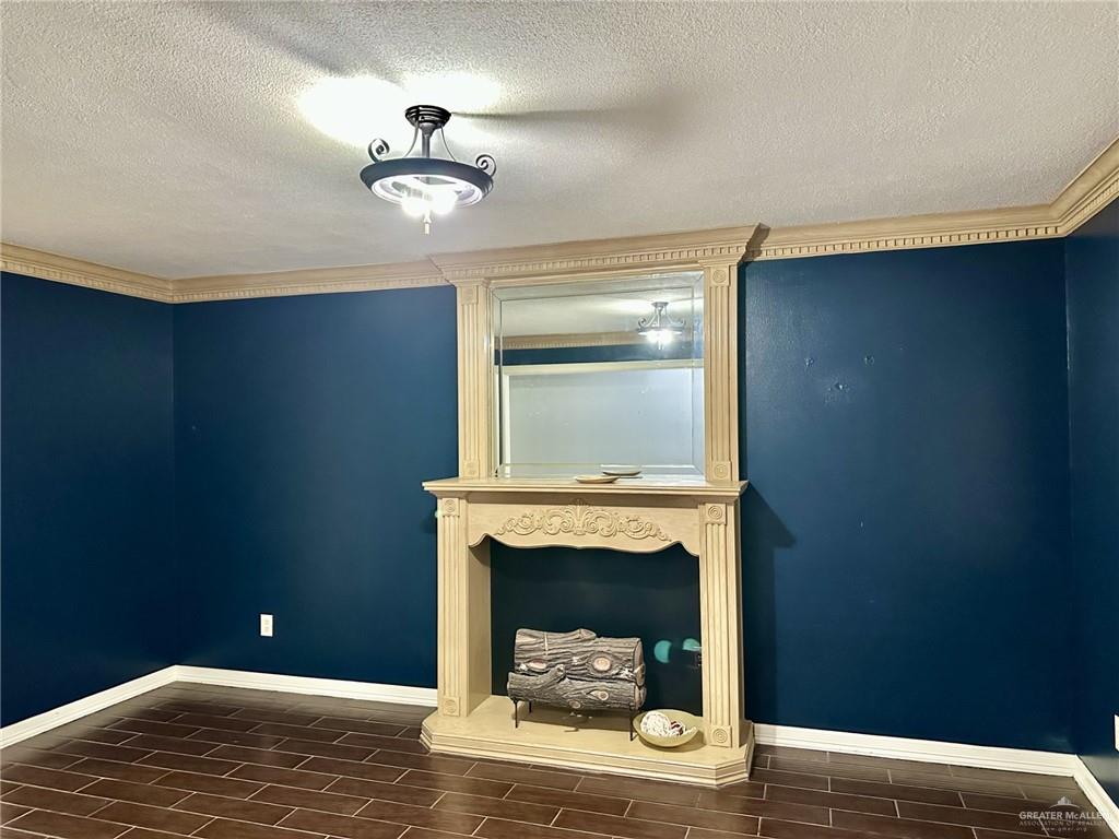1518 Redbud Avenue McAllen, TX 78504 - Photo 7 of 39 a bedroom with a bed and a ceiling fan