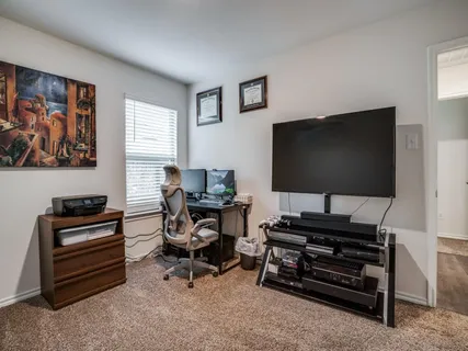 a room with furniture and a flat screen tv