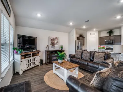 a living room with furniture and a flat screen tv