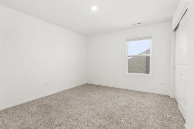 an empty room with a empty space and window