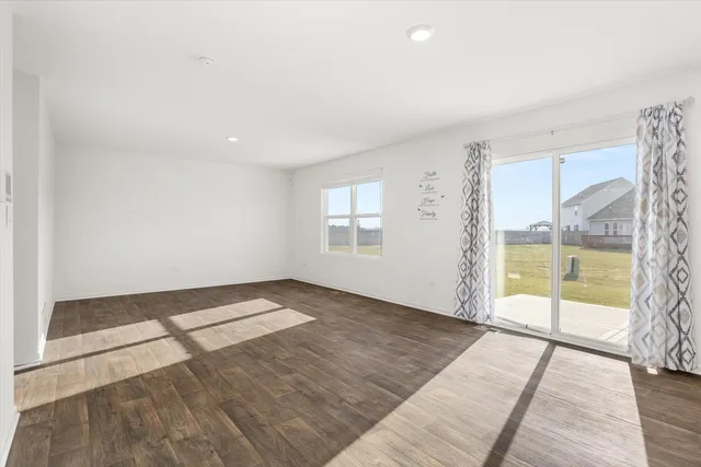 an empty room with windows