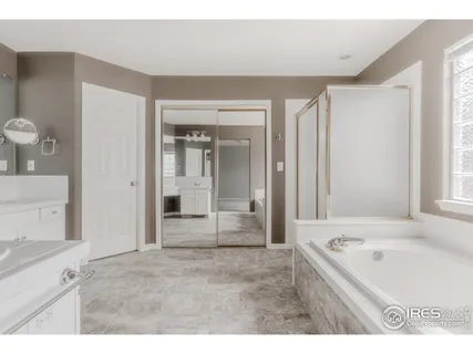 a bathroom with a sink double vanity and a mirror