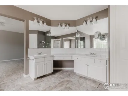 a bathroom with a bathtub and a view of living room
