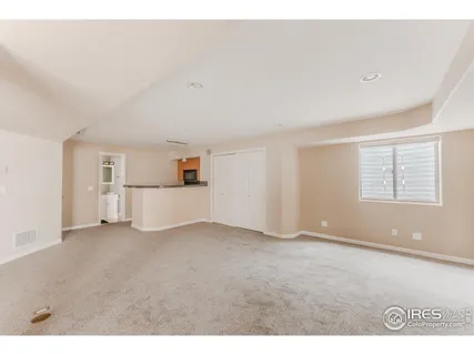 a view of empty room with a fireplace