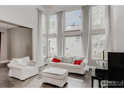 a view of living room with furniture and flat screen tv