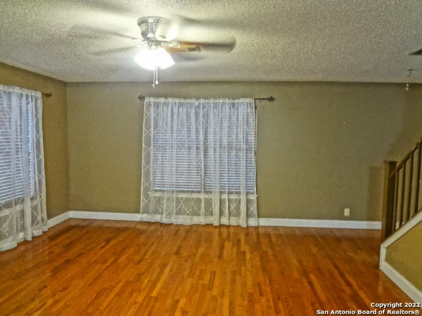 a view of a room with shelf on the wall