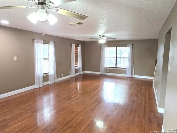 a kitchen with stainless steel appliances a stove a sink and a microwave