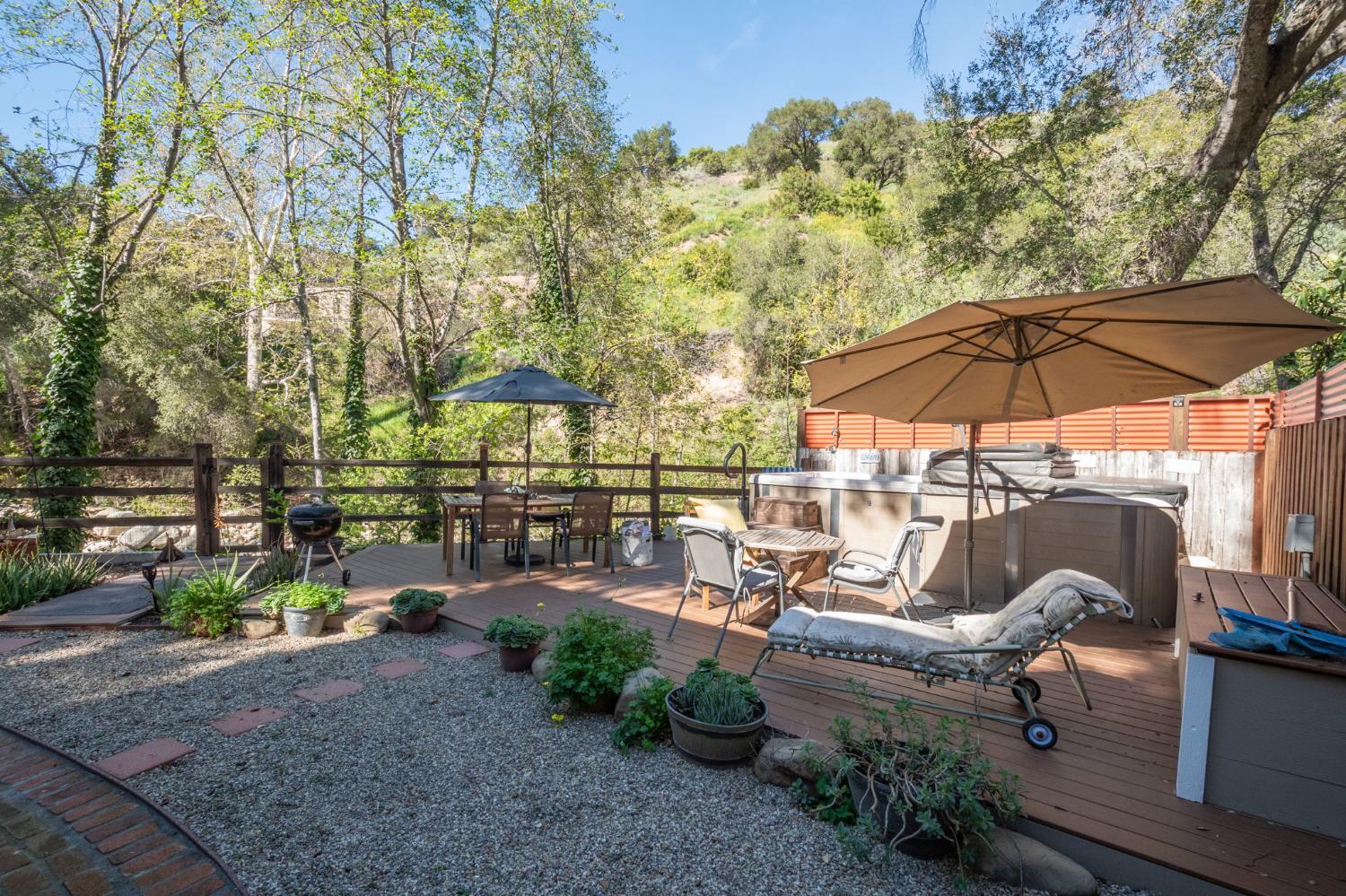 15663 Ojai Road Santa Paula, CA 93060 - Photo 36 of 47 a view of a patio with chairs under an umbrella