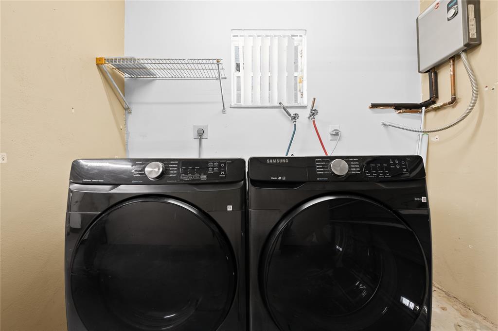 8245 Northwest 70th Street Tamarac, FL 33321 - Photo 14 of 29 a utility room with dryer and washer