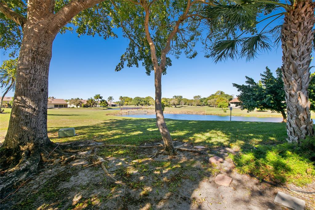 8245 Northwest 70th Street Tamarac, FL 33321 - Photo 16 of 29 a view of a lake with a big yard