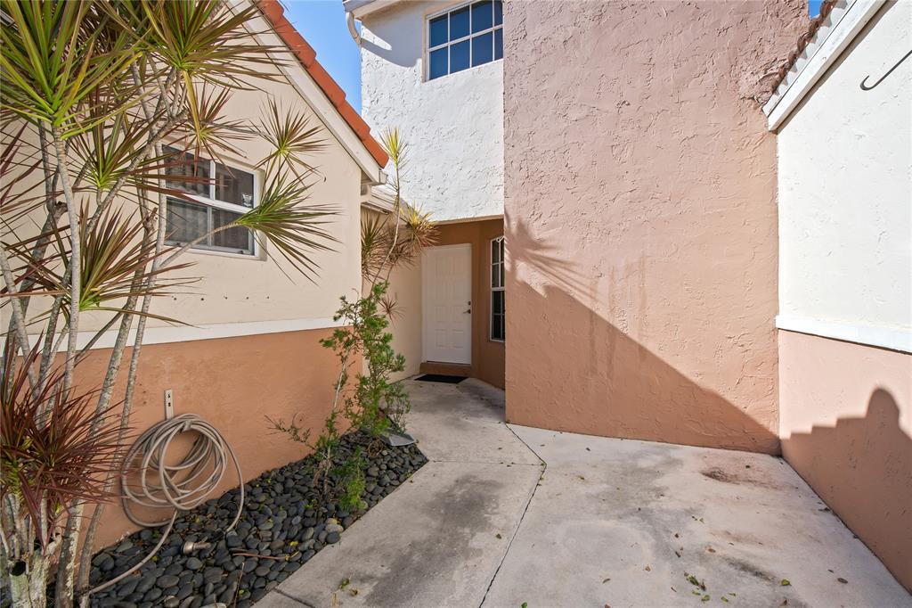 8245 Northwest 70th Street Tamarac, FL 33321 - Photo 26 of 29 a view of a back yard of a building