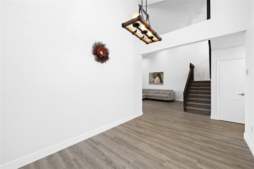 8245 Northwest 70th Street Tamarac, FL 33321 - Photo 5 of 29 a view of entryway and hall with wooden floor