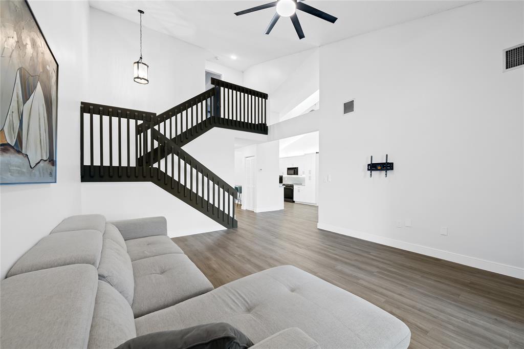 8245 Northwest 70th Street Tamarac, FL 33321 - Photo 7 of 29 a living room with furniture and a wooden floor