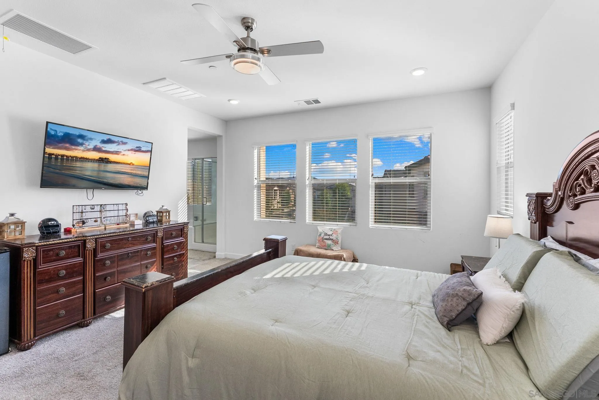 10129 Hercules Way Spring Valley, CA 91977 - Photo 19 of 52 a bedroom with a bed and a flat screen tv