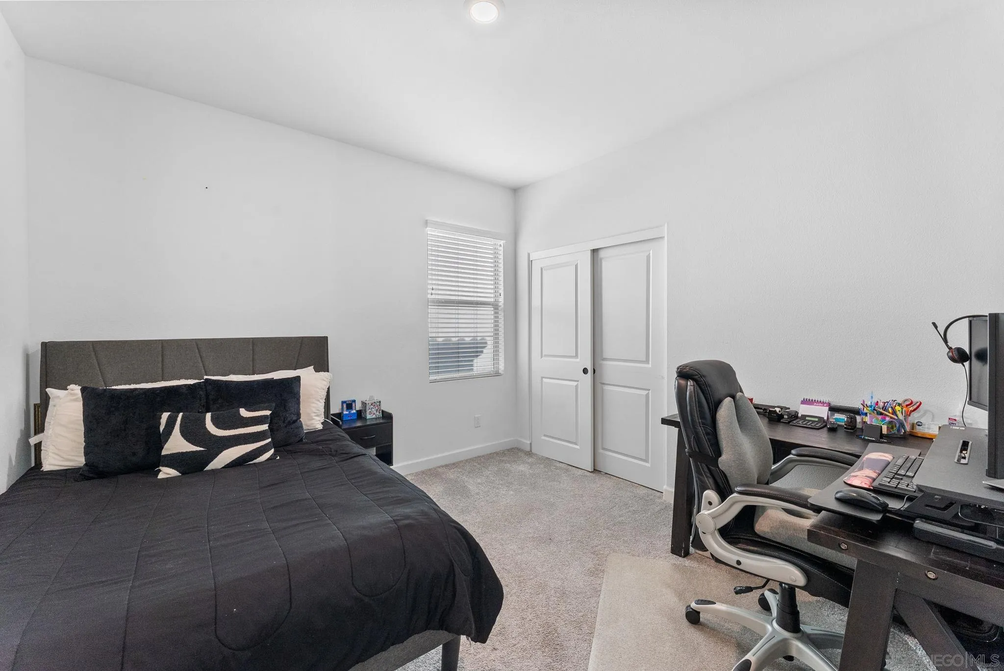 10129 Hercules Way Spring Valley, CA 91977 - Photo 22 of 52 a bedroom with a bed and a desk