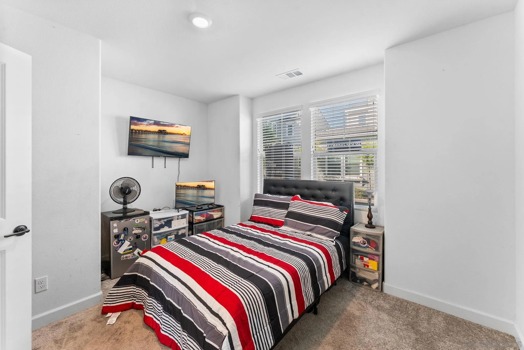 10129 Hercules Way Spring Valley, CA 91977 - Photo 24 of 52 a bedroom with bed and a flat screen tv