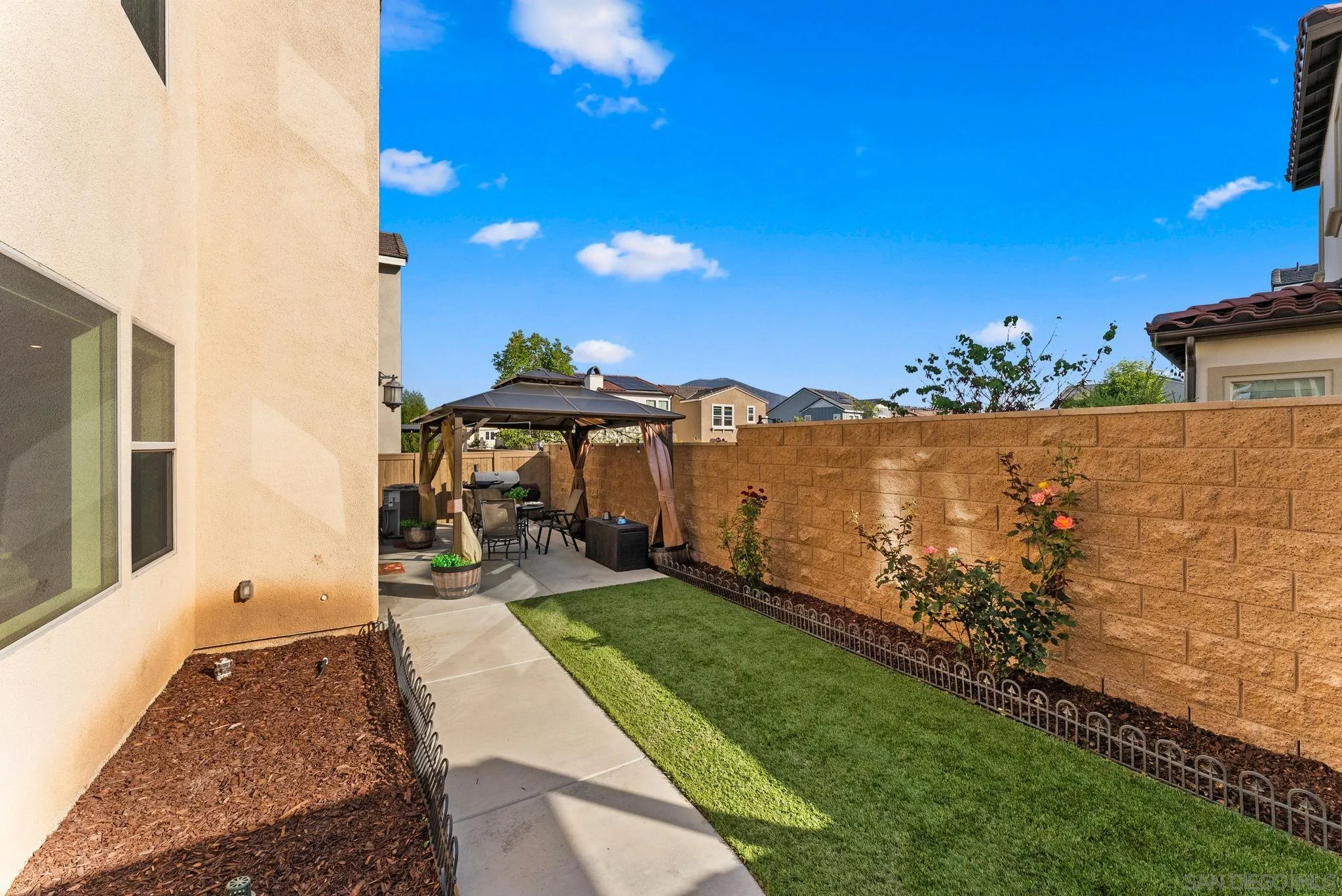 10129 Hercules Way Spring Valley, CA 91977 - Photo 29 of 52 a view of a backyard with sitting area