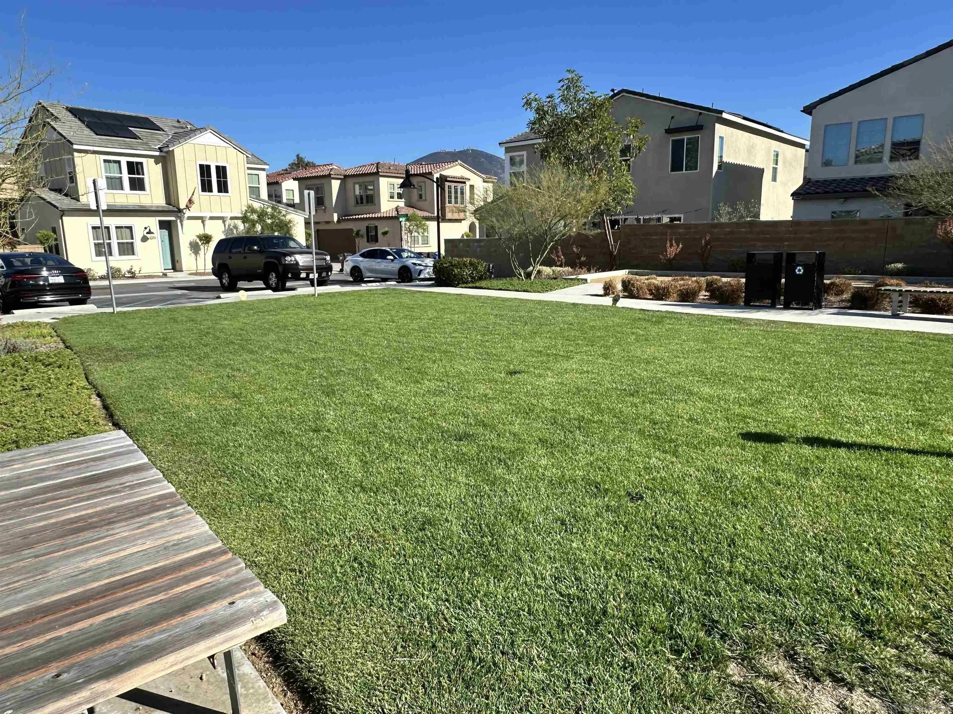 10129 Hercules Way Spring Valley, CA 91977 - Photo 35 of 52 a front view of a house with a yard table and chairs