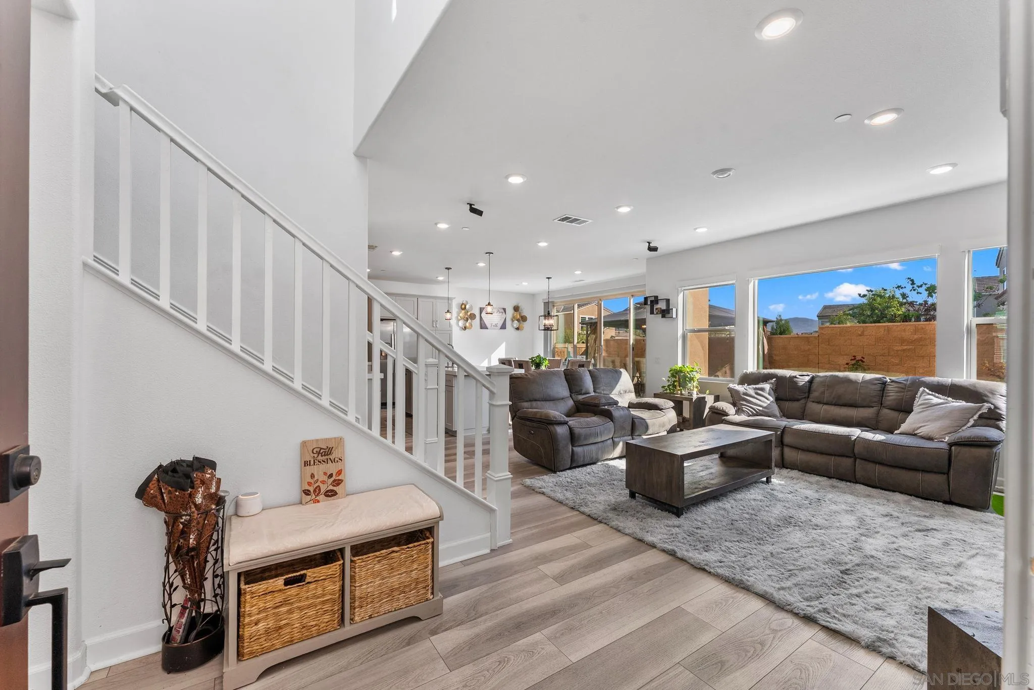 10129 Hercules Way Spring Valley, CA 91977 - Photo 5 of 52 a living room with furniture stairs and a ceiling fan