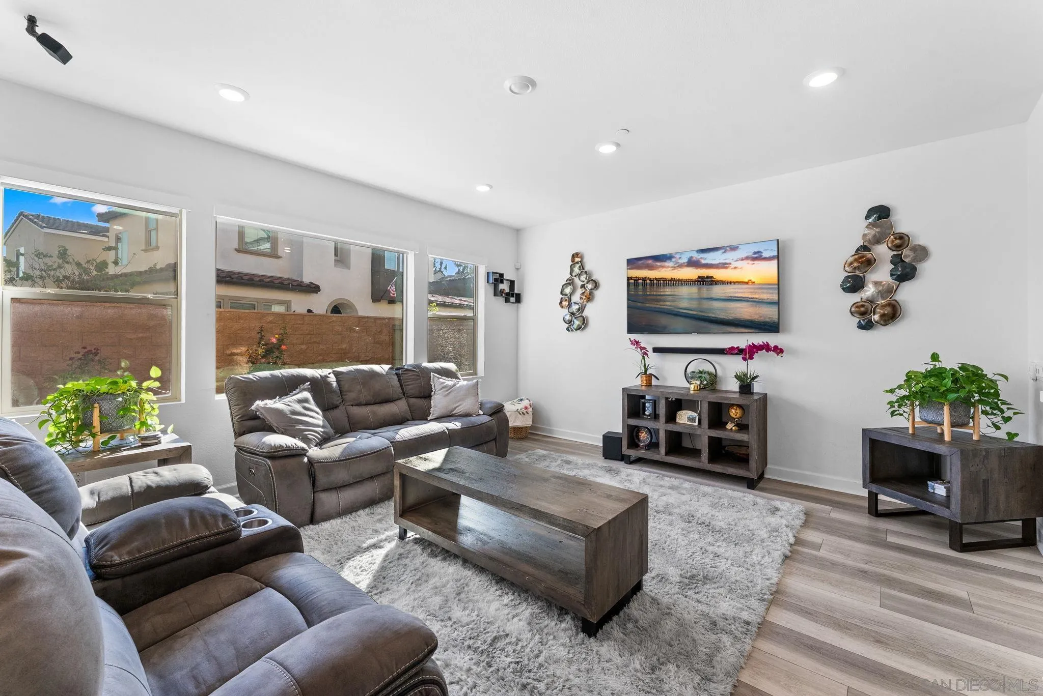 10129 Hercules Way Spring Valley, CA 91977 - Photo 7 of 52 a living room with furniture a fireplace and a flat screen tv