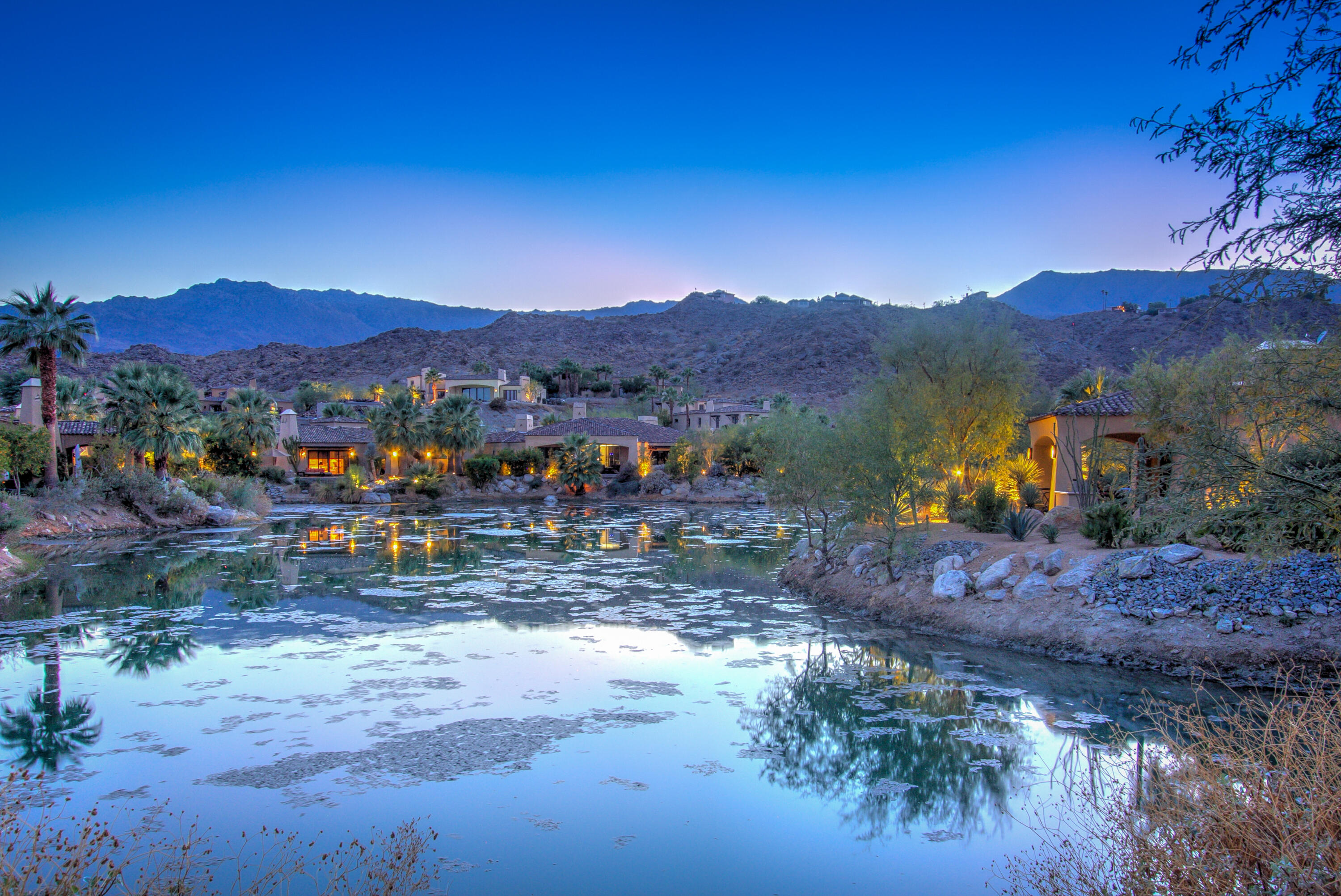 a view of a town with mountains in the background