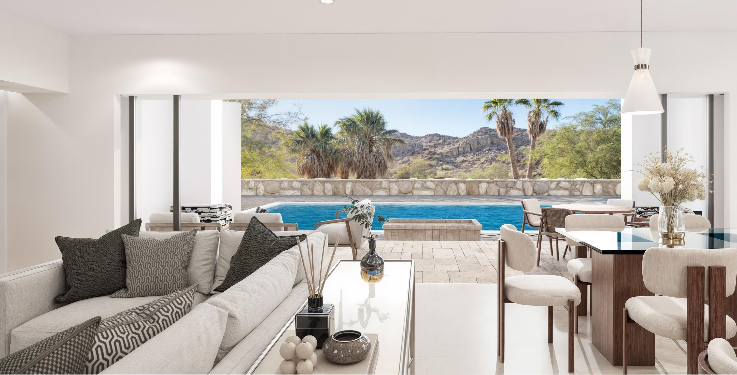 48499 Old Stone Trail Palm Desert, CA 92260 - Photo 3 of 11 a living room with furniture a large window and a table