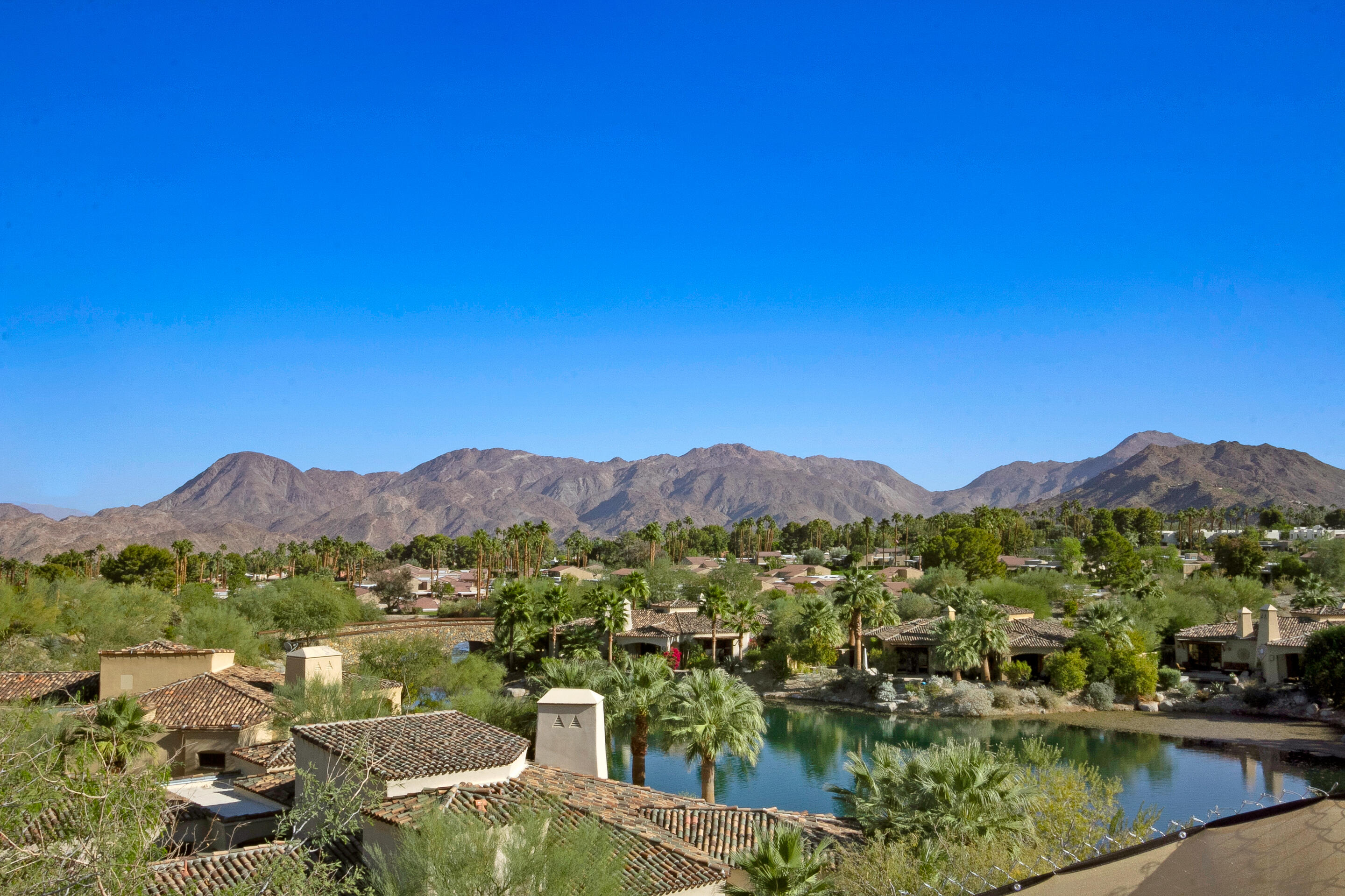 48499 Old Stone Trail Palm Desert, CA 92260 - Photo 8 of 11 a view of lake with mountain