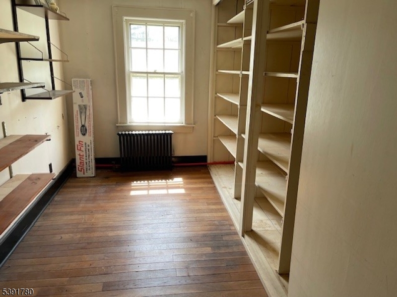 11 Creek Road Whitehouse Station, NJ 08889 - Photo 12 of 32 a view of empty room with wooden floor and fan