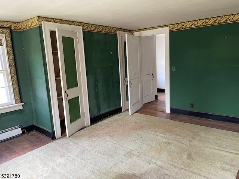 11 Creek Road Whitehouse Station, NJ 08889 - Photo 17 of 32 a view of a room with door and windows