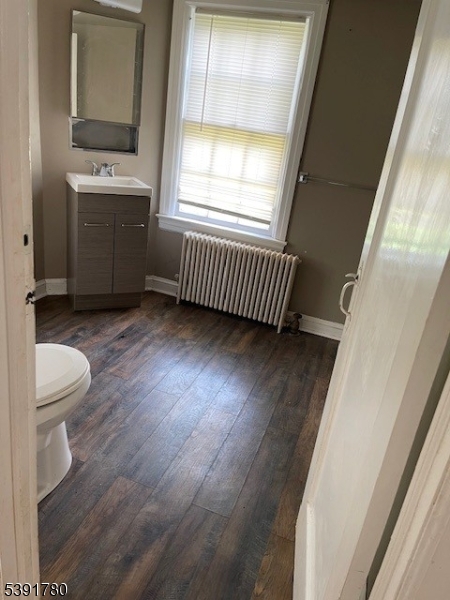 11 Creek Road Whitehouse Station, NJ 08889 - Photo 26 of 32 a view of an empty room with a window and wooden floor
