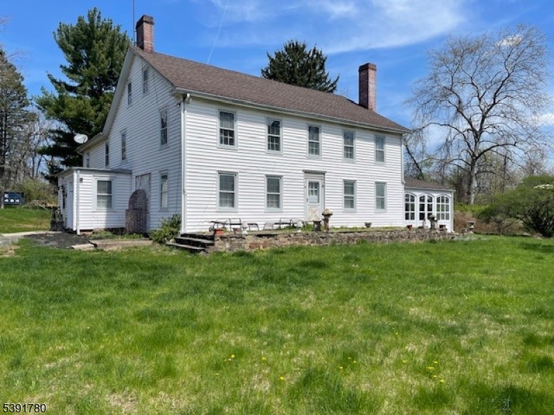 11 Creek Road Whitehouse Station, NJ 08889 - Photo 3 of 32 a front view of a house with a yard
