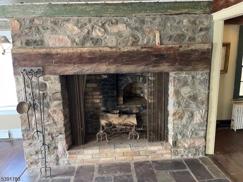 11 Creek Road Whitehouse Station, NJ 08889 - Photo 4 of 32 a room with water heater and a table