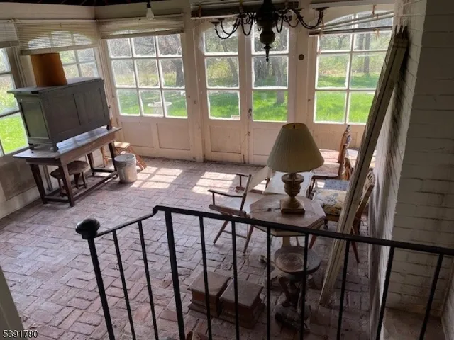 a balcony view with a seating space