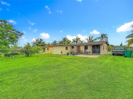 a view of a house with a big yard