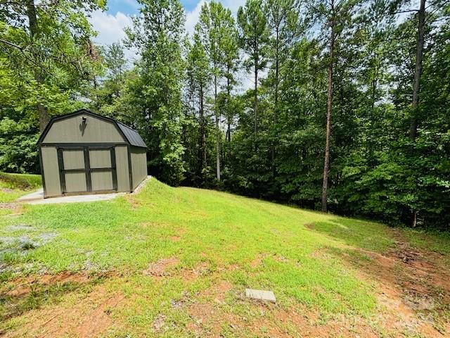 196 Moriah Drive Rutherfordton, NC 28139 - Photo 17 of 48 a view of a backyard with a small cabin
