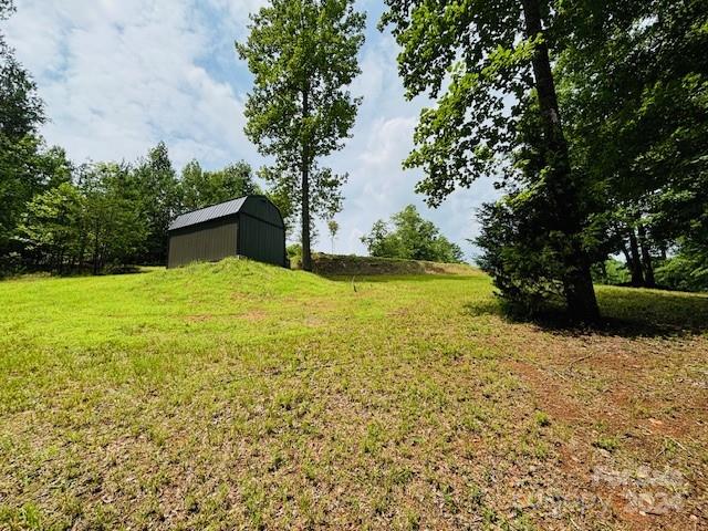 196 Moriah Drive Rutherfordton, NC 28139 - Photo 19 of 48 a view of a lake with a house