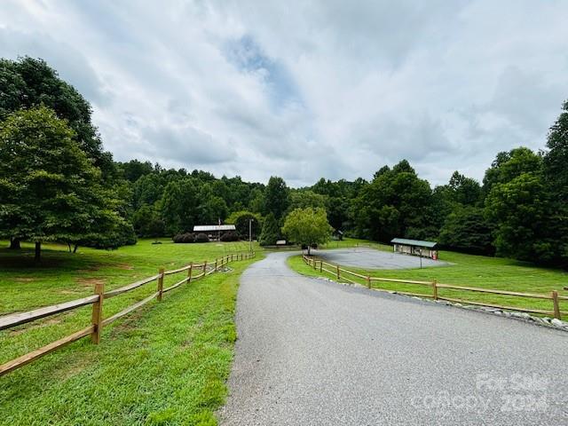 196 Moriah Drive Rutherfordton, NC 28139 - Photo 39 of 48 a view of a swimming pool with a yard and large trees